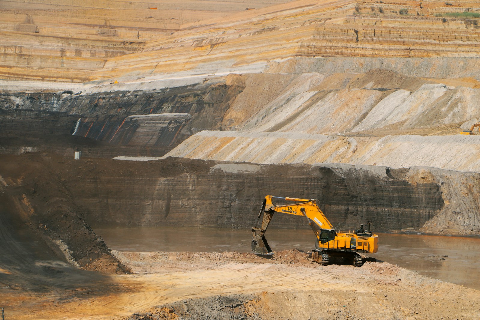 Open-pit mining operation with excavation equipment